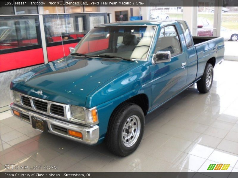 Vivid Teal Pearl Metallic / Gray 1995 Nissan Hardbody Truck XE Extended Cab