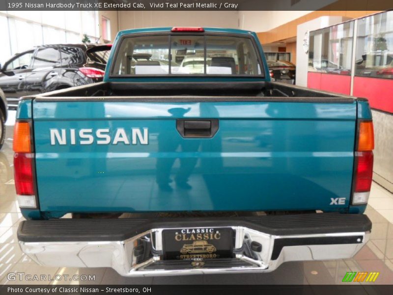 Vivid Teal Pearl Metallic / Gray 1995 Nissan Hardbody Truck XE Extended Cab