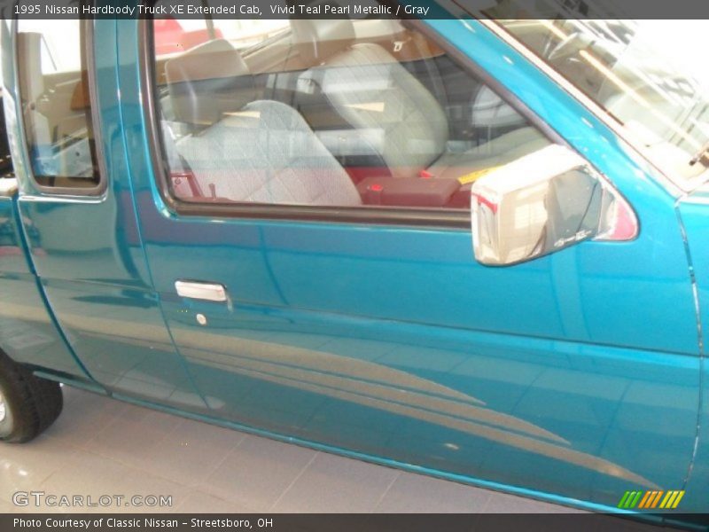 Vivid Teal Pearl Metallic / Gray 1995 Nissan Hardbody Truck XE Extended Cab