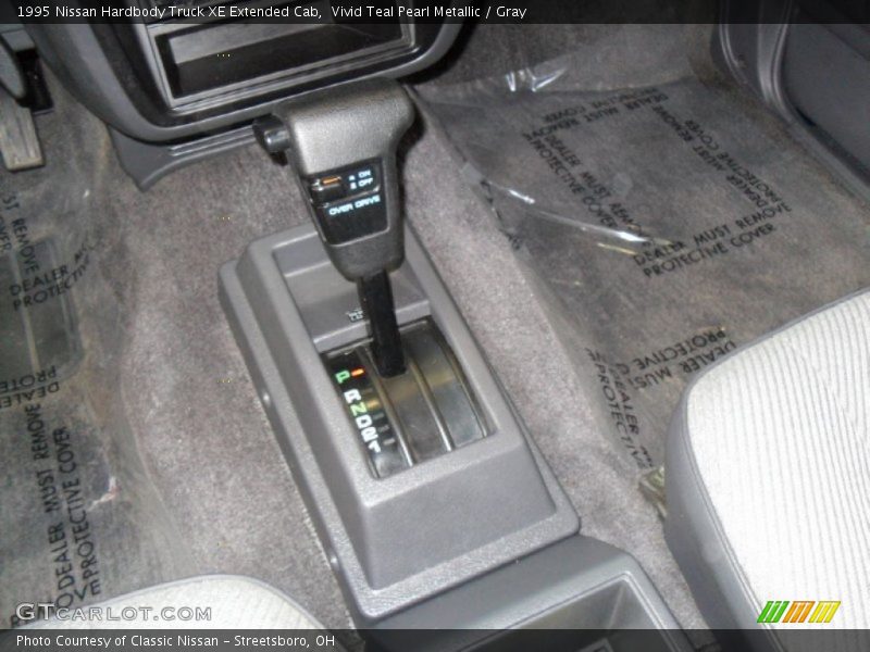 Vivid Teal Pearl Metallic / Gray 1995 Nissan Hardbody Truck XE Extended Cab