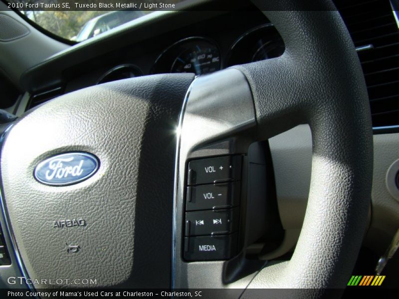 Tuxedo Black Metallic / Light Stone 2010 Ford Taurus SE