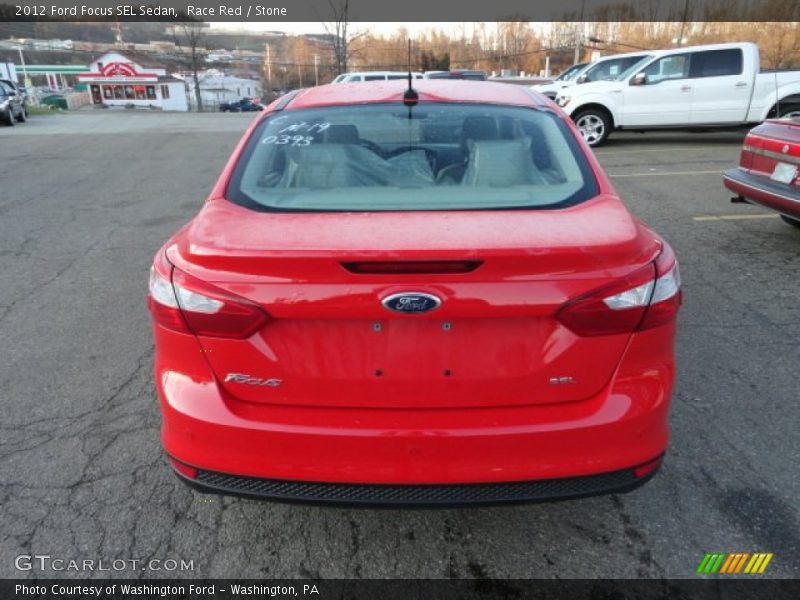 Race Red / Stone 2012 Ford Focus SEL Sedan