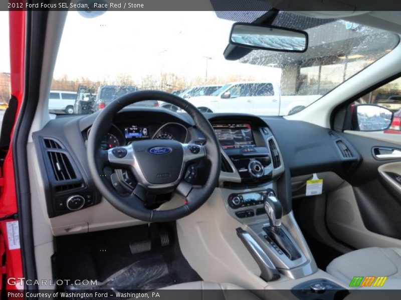 Race Red / Stone 2012 Ford Focus SEL Sedan