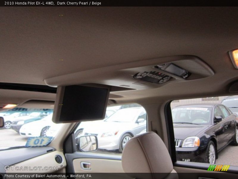Dark Cherry Pearl / Beige 2010 Honda Pilot EX-L 4WD