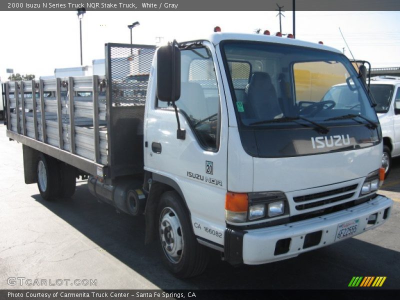 White / Gray 2000 Isuzu N Series Truck NQR Stake Truck