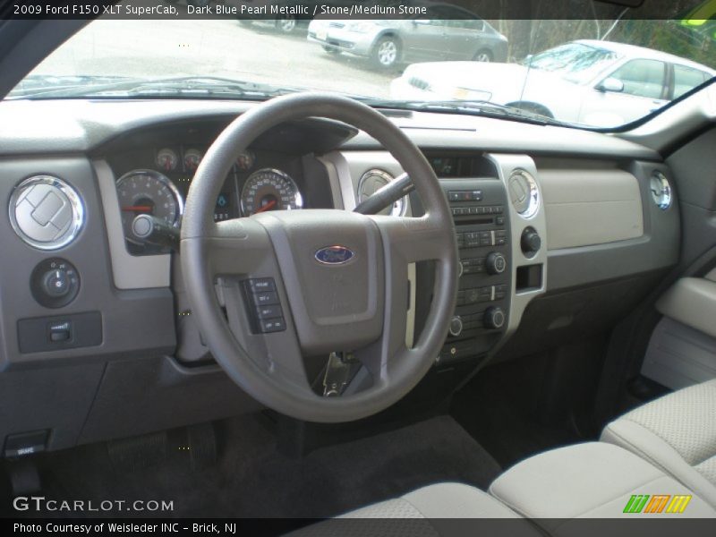 Dark Blue Pearl Metallic / Stone/Medium Stone 2009 Ford F150 XLT SuperCab