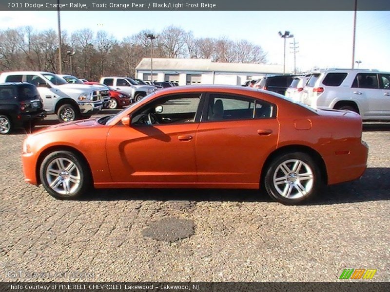 Toxic Orange Pearl / Black/Light Frost Beige 2011 Dodge Charger Rallye