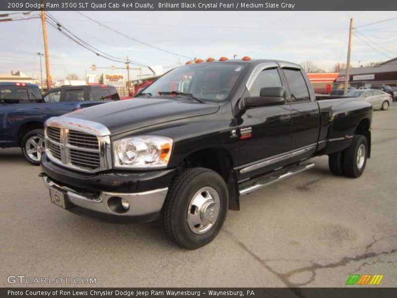 Front 3/4 View of 2009 Ram 3500 SLT Quad Cab 4x4 Dually