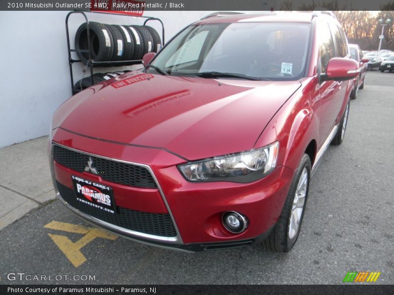 Rally Red Metallic / Black 2010 Mitsubishi Outlander SE 4WD