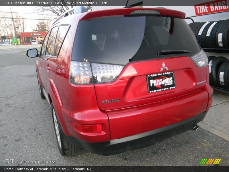 Rally Red Metallic / Black 2010 Mitsubishi Outlander SE 4WD