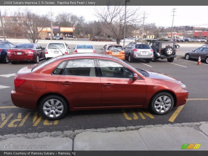 Paprika Red Pearl / Ivory 2009 Subaru Impreza 2.5i Sedan