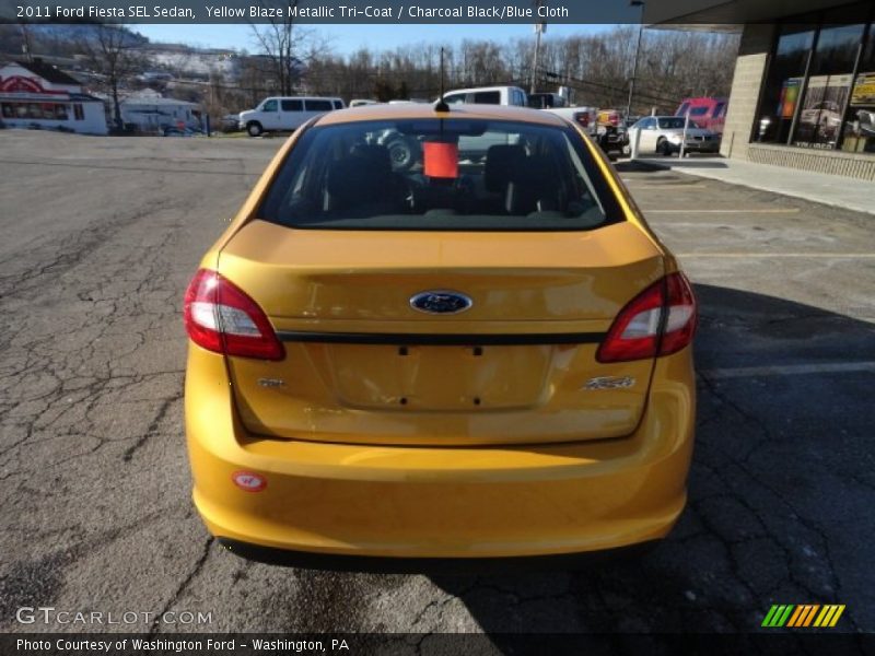 Yellow Blaze Metallic Tri-Coat / Charcoal Black/Blue Cloth 2011 Ford Fiesta SEL Sedan