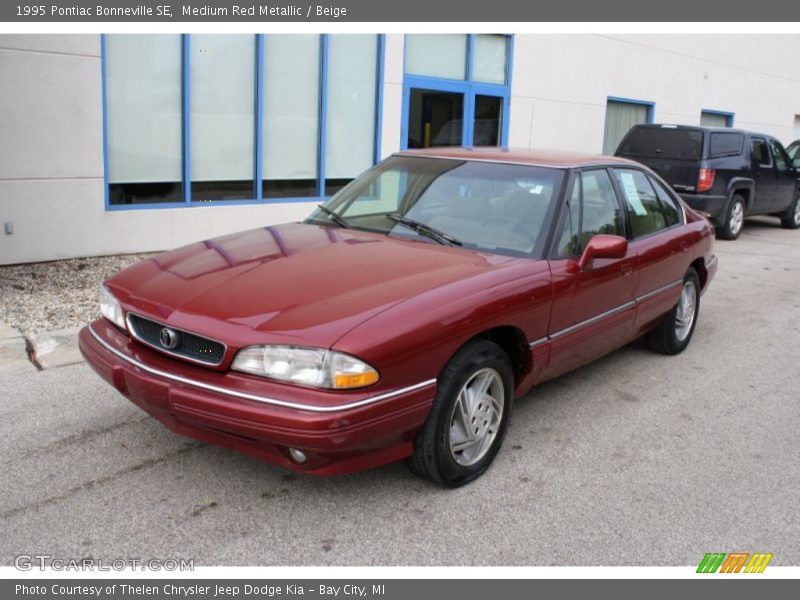 Medium Red Metallic / Beige 1995 Pontiac Bonneville SE