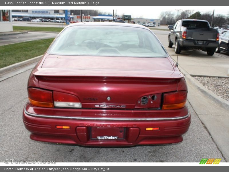 Medium Red Metallic / Beige 1995 Pontiac Bonneville SE