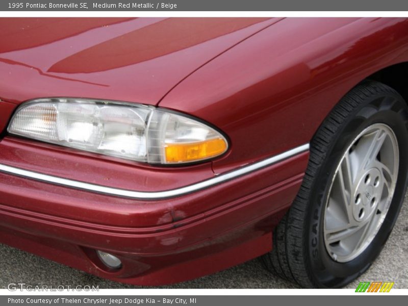 Medium Red Metallic / Beige 1995 Pontiac Bonneville SE