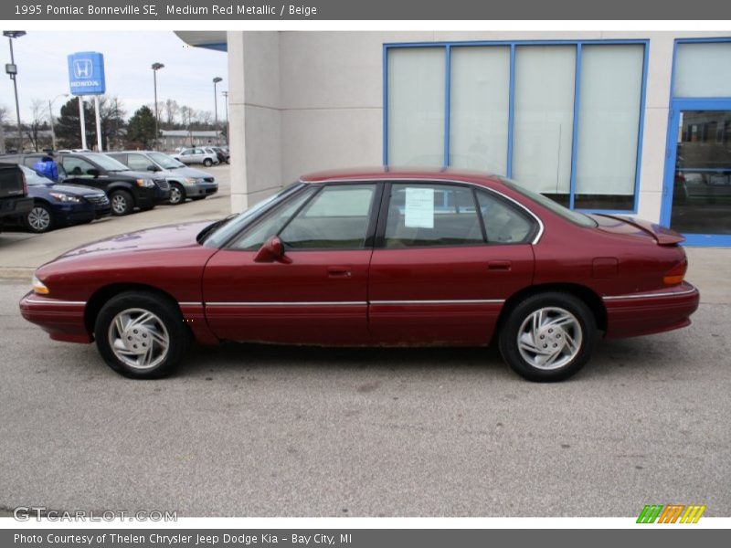 Medium Red Metallic / Beige 1995 Pontiac Bonneville SE