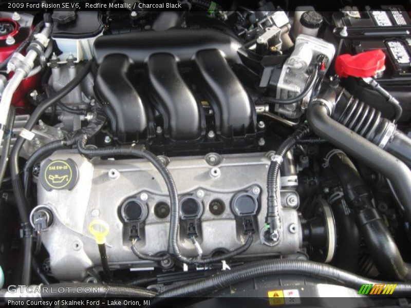 Redfire Metallic / Charcoal Black 2009 Ford Fusion SE V6