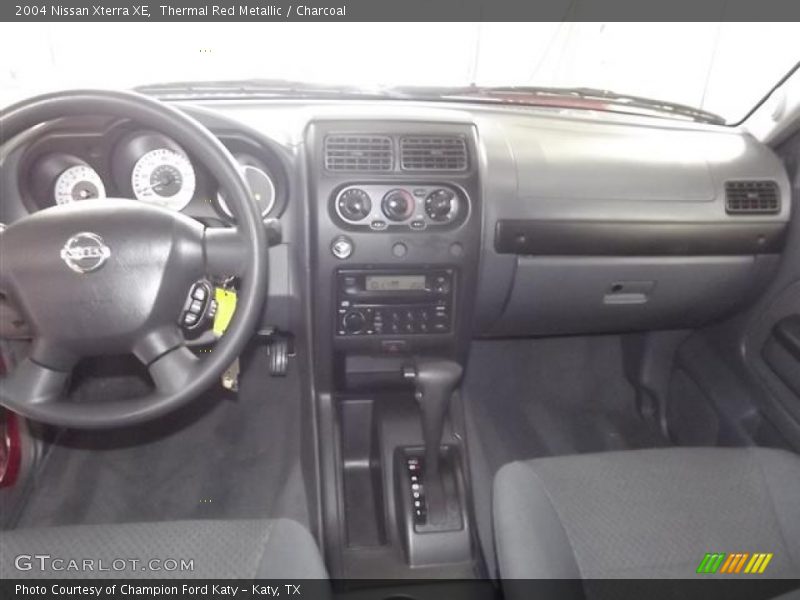 Thermal Red Metallic / Charcoal 2004 Nissan Xterra XE