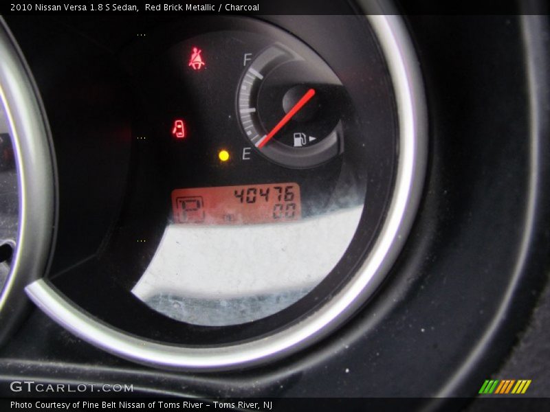 Red Brick Metallic / Charcoal 2010 Nissan Versa 1.8 S Sedan