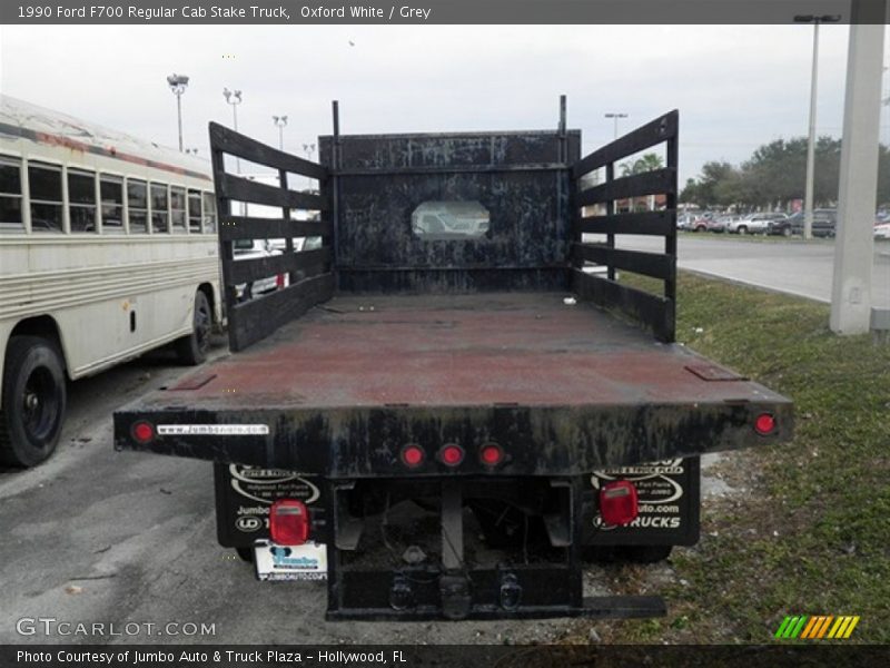 Oxford White / Grey 1990 Ford F700 Regular Cab Stake Truck
