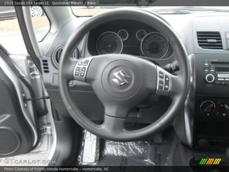 Quicksilver Metallic / Black 2010 Suzuki SX4 Sedan LE