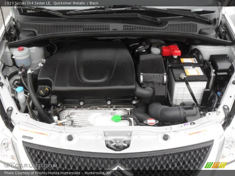 Quicksilver Metallic / Black 2010 Suzuki SX4 Sedan LE