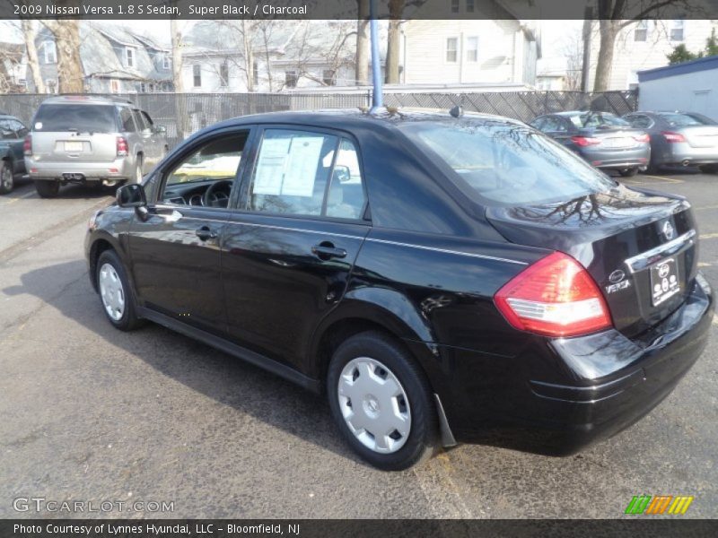 Super Black / Charcoal 2009 Nissan Versa 1.8 S Sedan