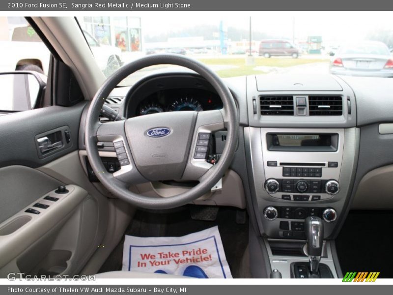 Sangria Red Metallic / Medium Light Stone 2010 Ford Fusion SE