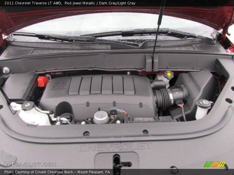 Red Jewel Metallic / Dark Gray/Light Gray 2011 Chevrolet Traverse LT AWD