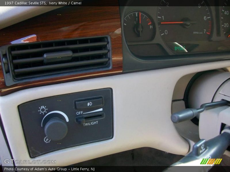 Ivory White / Camel 1997 Cadillac Seville STS