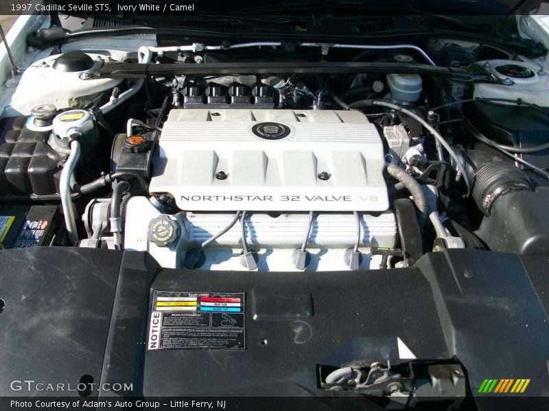 Ivory White / Camel 1997 Cadillac Seville STS