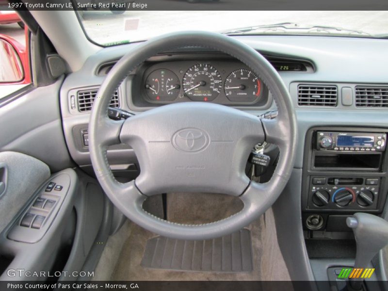 Sunfire Red Pearl / Beige 1997 Toyota Camry LE
