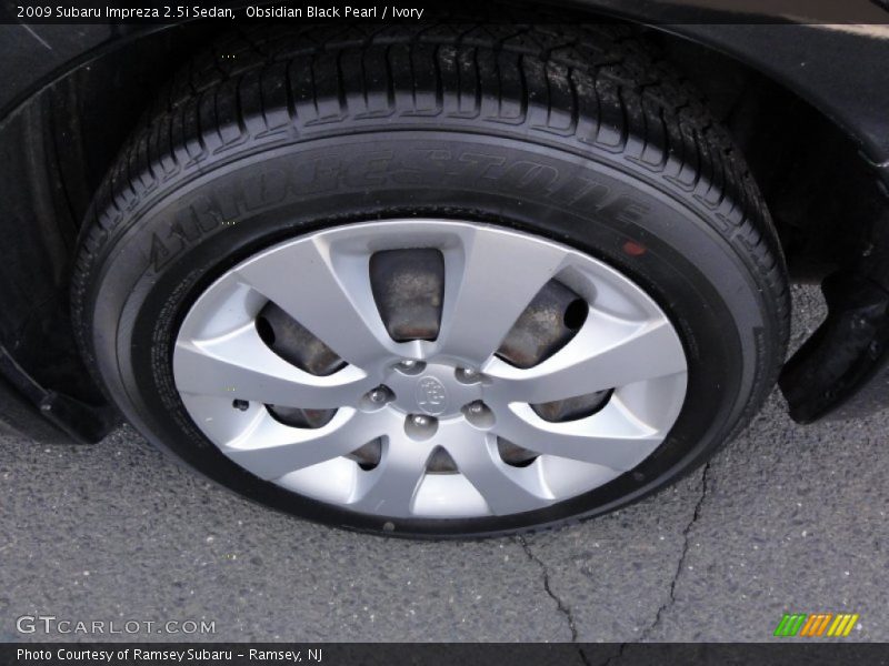 Obsidian Black Pearl / Ivory 2009 Subaru Impreza 2.5i Sedan
