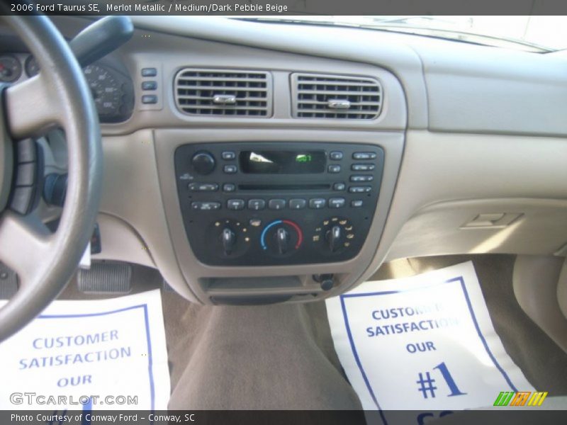 Merlot Metallic / Medium/Dark Pebble Beige 2006 Ford Taurus SE