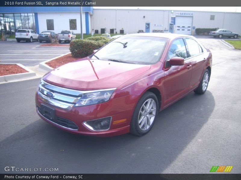 Sangria Red Metallic / Camel 2010 Ford Fusion SEL