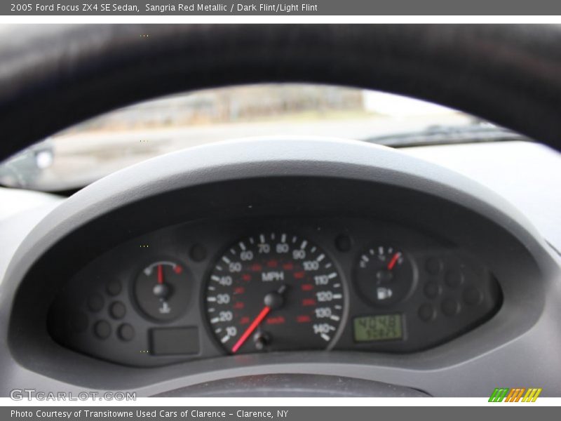 Sangria Red Metallic / Dark Flint/Light Flint 2005 Ford Focus ZX4 SE Sedan