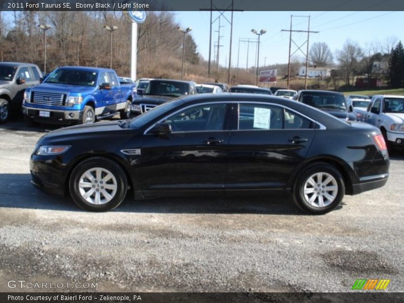 Ebony Black / Light Stone 2011 Ford Taurus SE