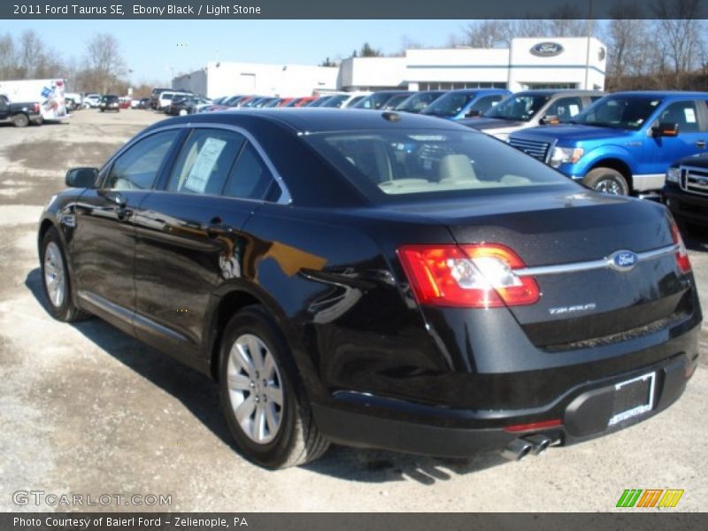 Ebony Black / Light Stone 2011 Ford Taurus SE