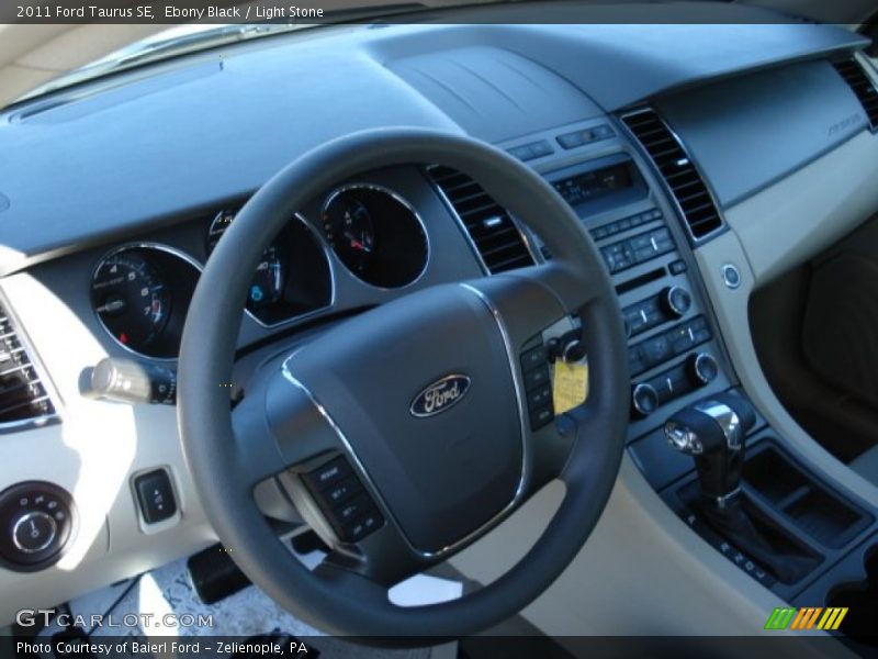 Ebony Black / Light Stone 2011 Ford Taurus SE