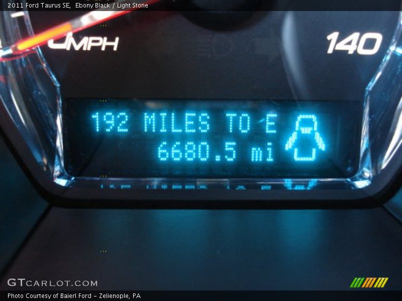 Ebony Black / Light Stone 2011 Ford Taurus SE