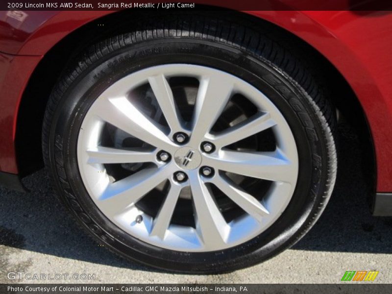 Sangria Red Metallic / Light Camel 2009 Lincoln MKS AWD Sedan