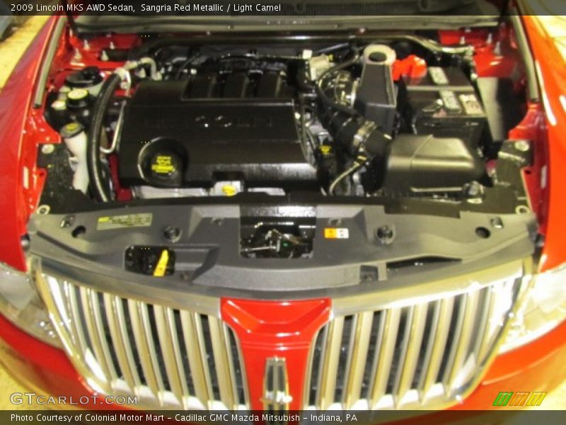 Sangria Red Metallic / Light Camel 2009 Lincoln MKS AWD Sedan