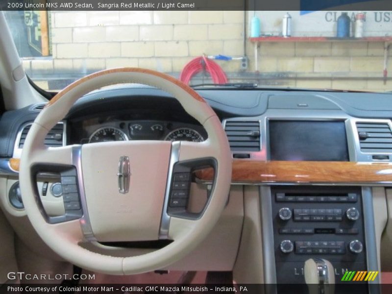 Sangria Red Metallic / Light Camel 2009 Lincoln MKS AWD Sedan