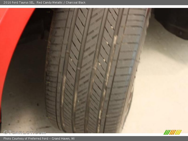 Red Candy Metallic / Charcoal Black 2010 Ford Taurus SEL