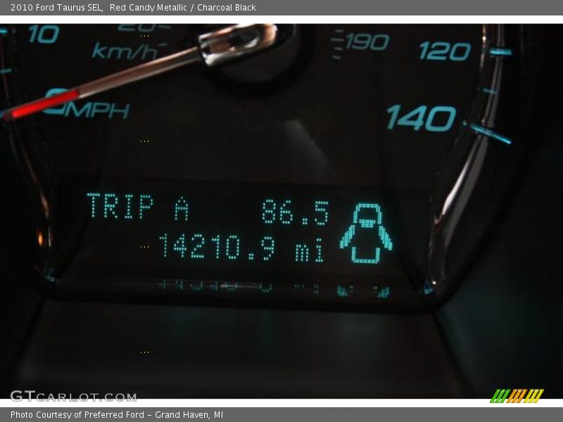 Red Candy Metallic / Charcoal Black 2010 Ford Taurus SEL