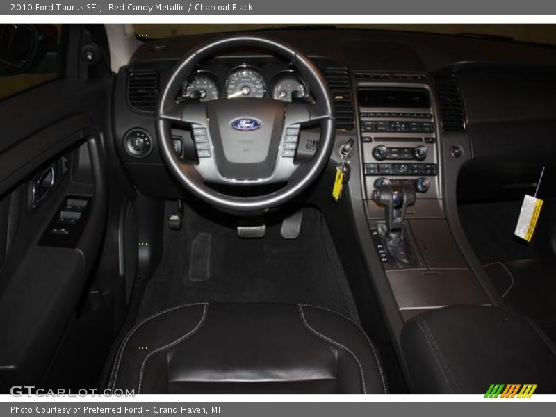 Red Candy Metallic / Charcoal Black 2010 Ford Taurus SEL