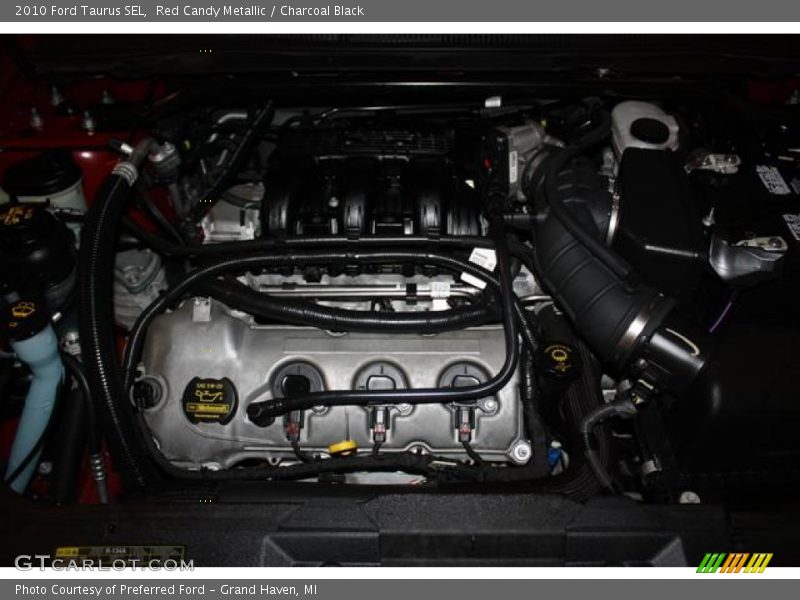 Red Candy Metallic / Charcoal Black 2010 Ford Taurus SEL