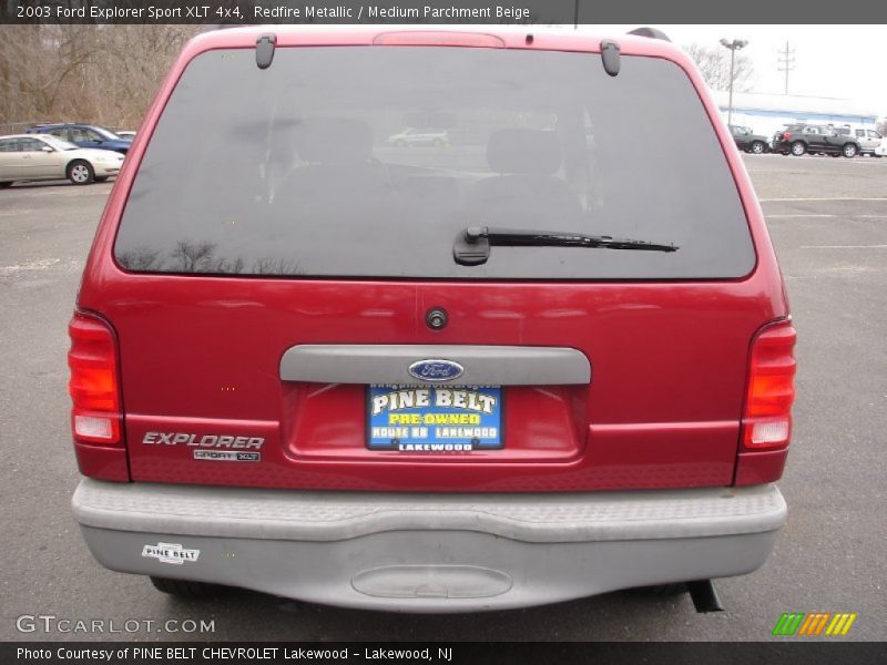 Redfire Metallic / Medium Parchment Beige 2003 Ford Explorer Sport XLT 4x4