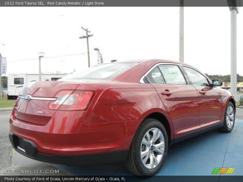 Red Candy Metallic / Light Stone 2012 Ford Taurus SEL