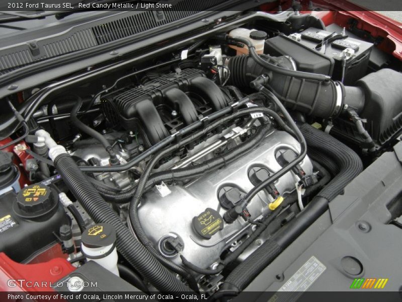 Red Candy Metallic / Light Stone 2012 Ford Taurus SEL